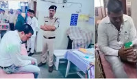 ভারতের মধ্যপ্রদেশে পুলিশ দেখে ঘুষের অর্থ গিলে ফেললেন রাজস্ব কর্মকর্তা