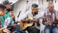 গাজার ড্রোনের ভোঁ ভোঁ শব্দে গানের সুর, যুদ্ধের যন্ত্রণা হয়ে উঠল প্রতিবাদের ভাষা