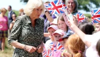 King Charles Arrives in Rolls-Royce as Queen Camilla Celebrates Winnie-the-Pooh's 100th Anniversary in Woodland Tribute