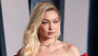 Supermodel Gigi Hadid Turns Heads in Flamingo-Pink Gown at Taylor Swift and Travis Kelce’s Star-Studded Wedding
